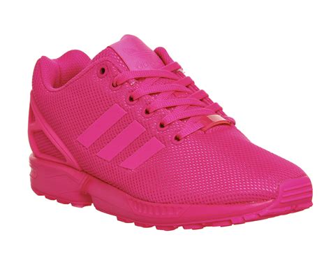 bright pink adidas sneakers.